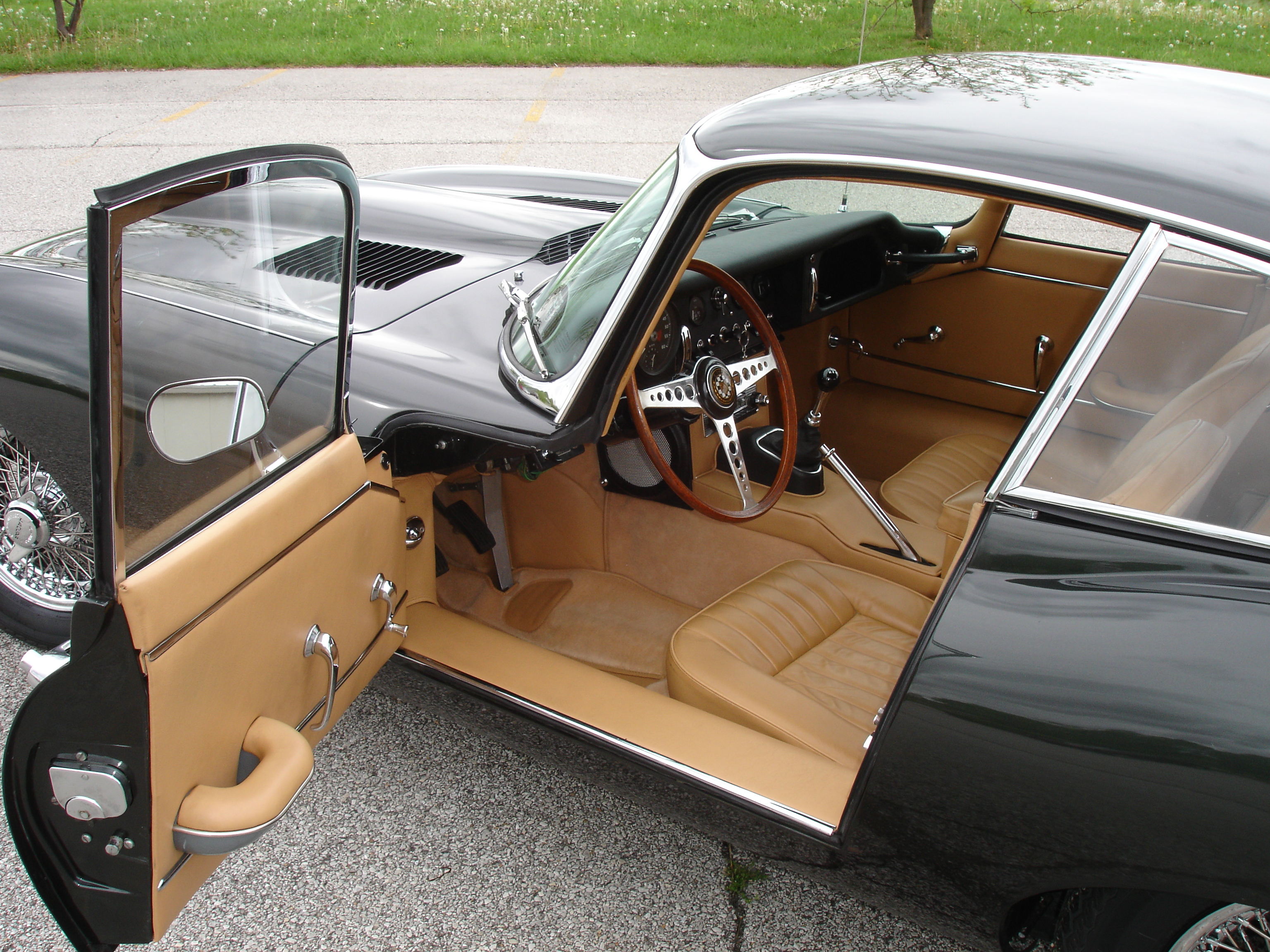 Drivers side door open on a 1966 Jaguar XKE coupe